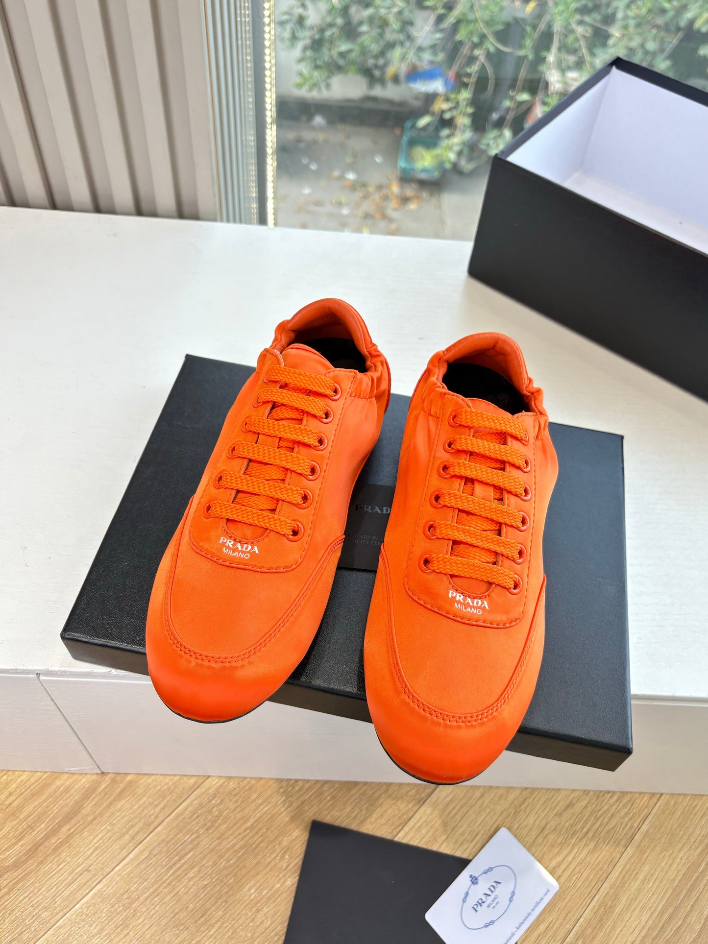 Prada 25s Sneaker In Orange Silk