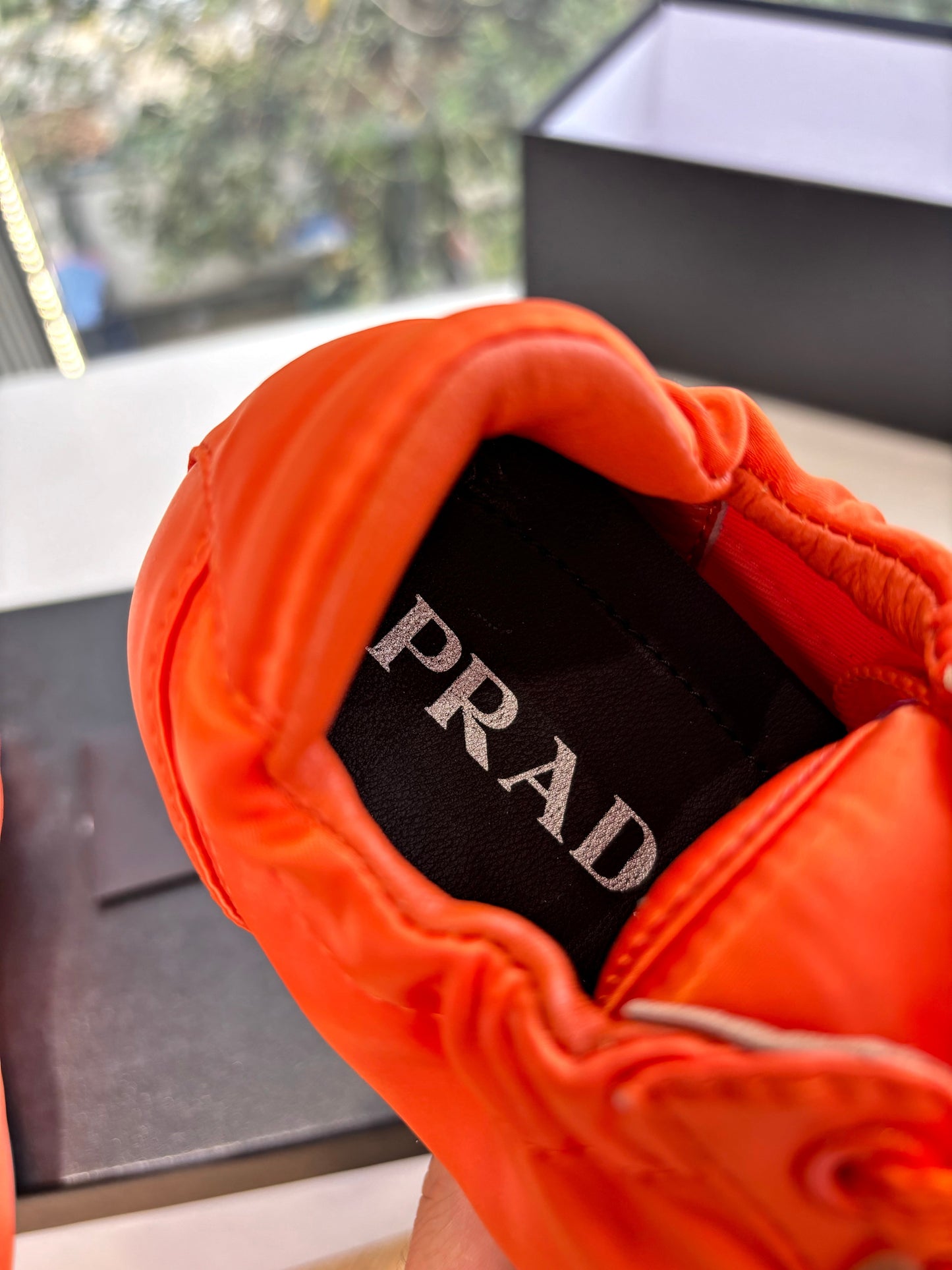 Prada 25s Sneaker In Orange Silk