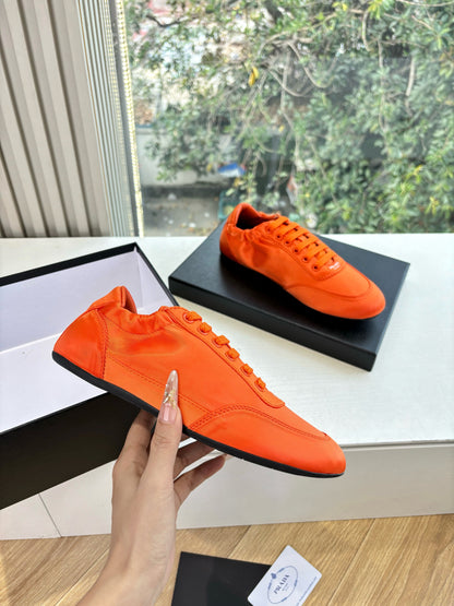 Prada 25s Sneaker In Orange Silk