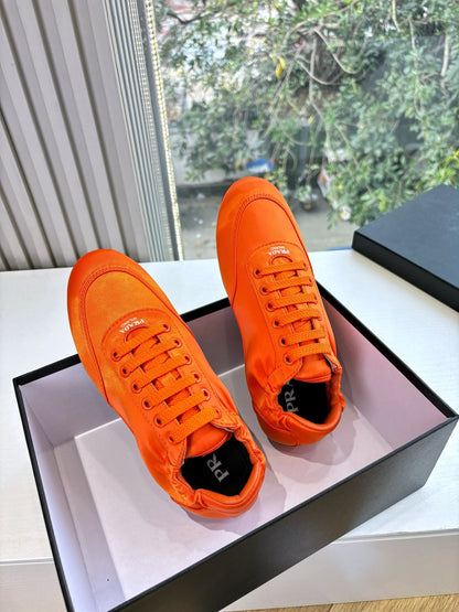 Prada 25s Sneaker In Orange Silk
