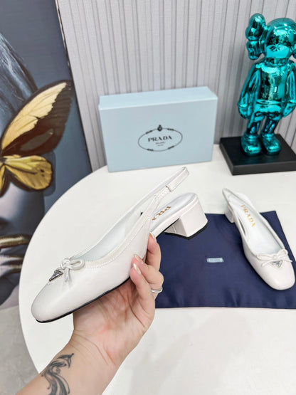 Prada 26s Round Toe Slingback Pumps 40mm In White Calfskin With Bow