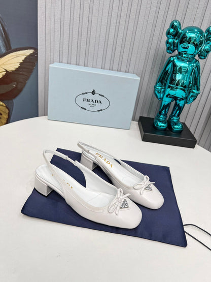 Prada 26s Round Toe Slingback Pumps 40mm In White Calfskin With Bow