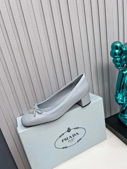Prada 26s Round Toe Pumps Block Heel 40mm In Light Blue Calfskin With Bow